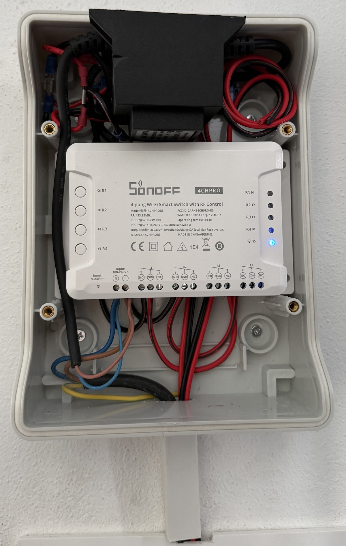 Inside the enclosure — 24 VAC transformer on top, Sonoff 4CH Pro R3 below